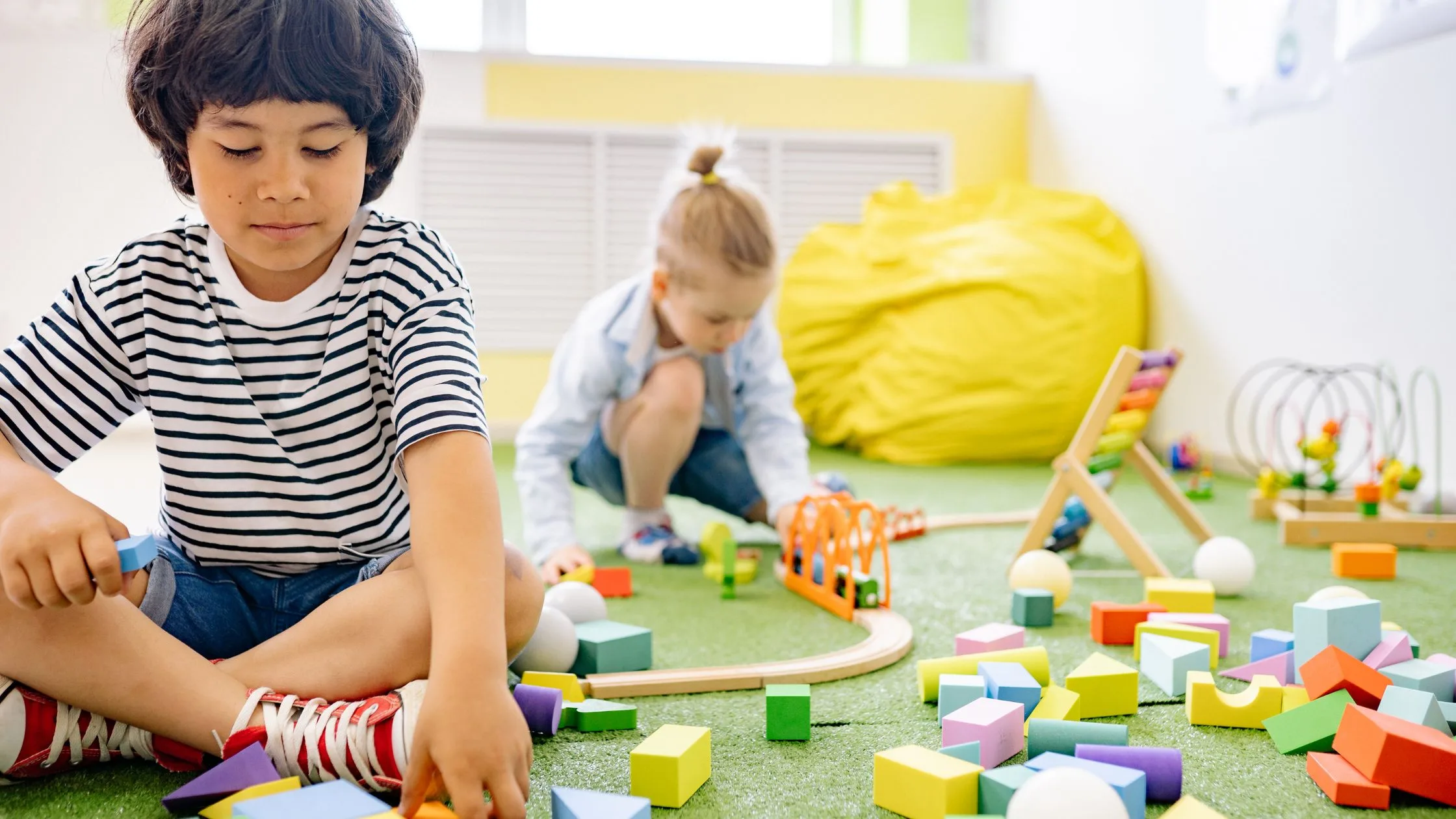 Children engaged in hands-on play in an early learning classroom